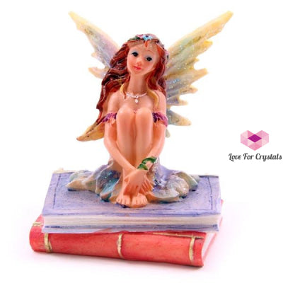 Flower Fairy Sitting On Books