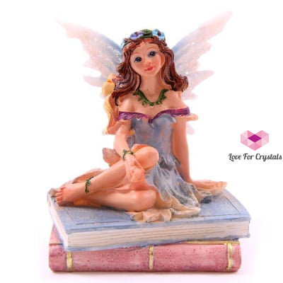 Flower Fairy Sitting On Books