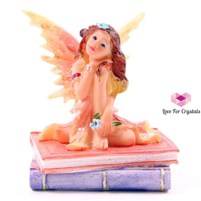 Flower Fairy Sitting On Books